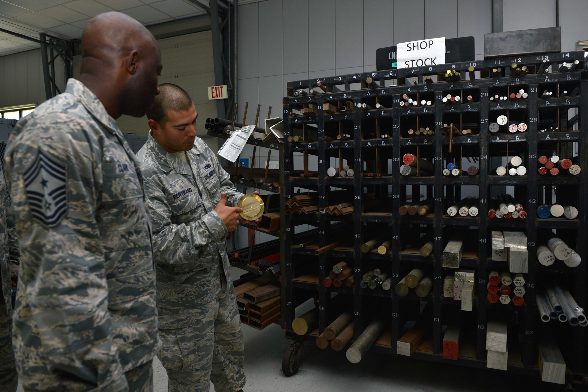 U.S. Air Force Staff Sgt. Steve Bertrand, 39th Maintenance Squadron metals technology craftsman, explains different types of materials to U.S. Air Force Chief Master Sgt. Vegas Clark, 39th Air Base Wing command chief, June 22, 2016, at Incirlik Air Base, Turkey. The rack contains authorized material used for fabrication and repair. (U.S. Air Force photo by Senior Airman John Nieves Camacho/Released)