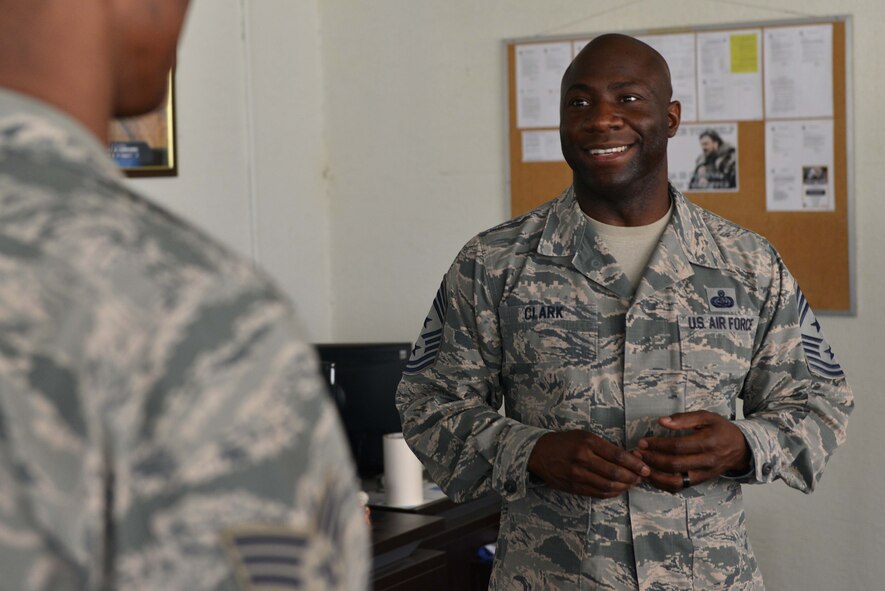 U.S. Air Force Chief Master Sgt. Vegas Clark, 39th Air Base Wing command chief, speaks to U.S. Air Force Senior Airman Chance Hailey, 39th Maintenance Squadron crash recovery team member, June 22, 2016, at Incirlik Air Base, Turkey. Clark was able to meet and interact with Airmen of the 39th MXS. (U.S. Air Force photo by Senior Airman John Nieves Camacho/Released)