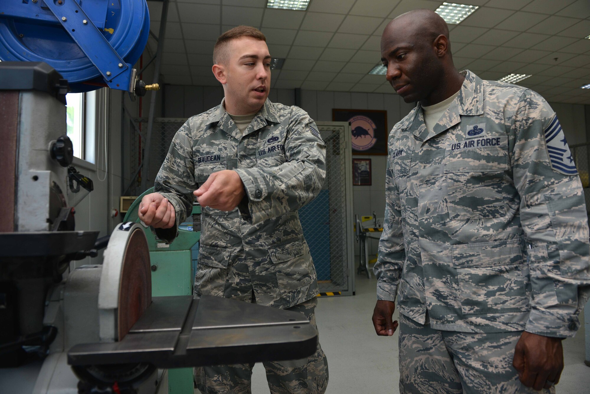 U.S. Air Force Staff Sgt. Justin Beaudean, 39th Maintenance Squadron structural maintenance craftsman, explains equipment operation to U.S. Air Force Chief Master Sgt. Vegas Clark, 39th Air Base Wing command chief, June 22, 2016, at Incirlik Air Base, Turkey. Clark visited the maintenance support flight to expand his knowledge and see the different sections’ functions. (U.S. Air Force photo by Senior Airman John Nieves Camacho/Released)