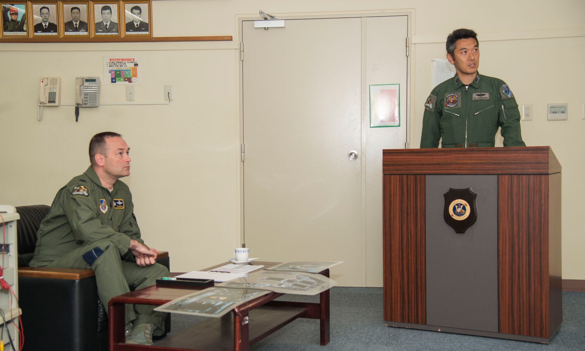 U.S. Air Force Col. Timothy Sundvall (left), the commander of the 35th Fighter Wing, receives a mission brief given by Japan Air Self-Defense Force Lt. Col. Mikio Kobayashi, the commander of the 3rd Fighter Squadron, at Misawa Air Base, Japan, June 22, 2016. The brief was tailored to give Sundvall information about the differences between the F-2A and the F-16 Fighting Falcon, so he could properly operate and understand the aircraft once in the air. (U.S. Air Force photo by Senior Airman Brittany A. Chase)