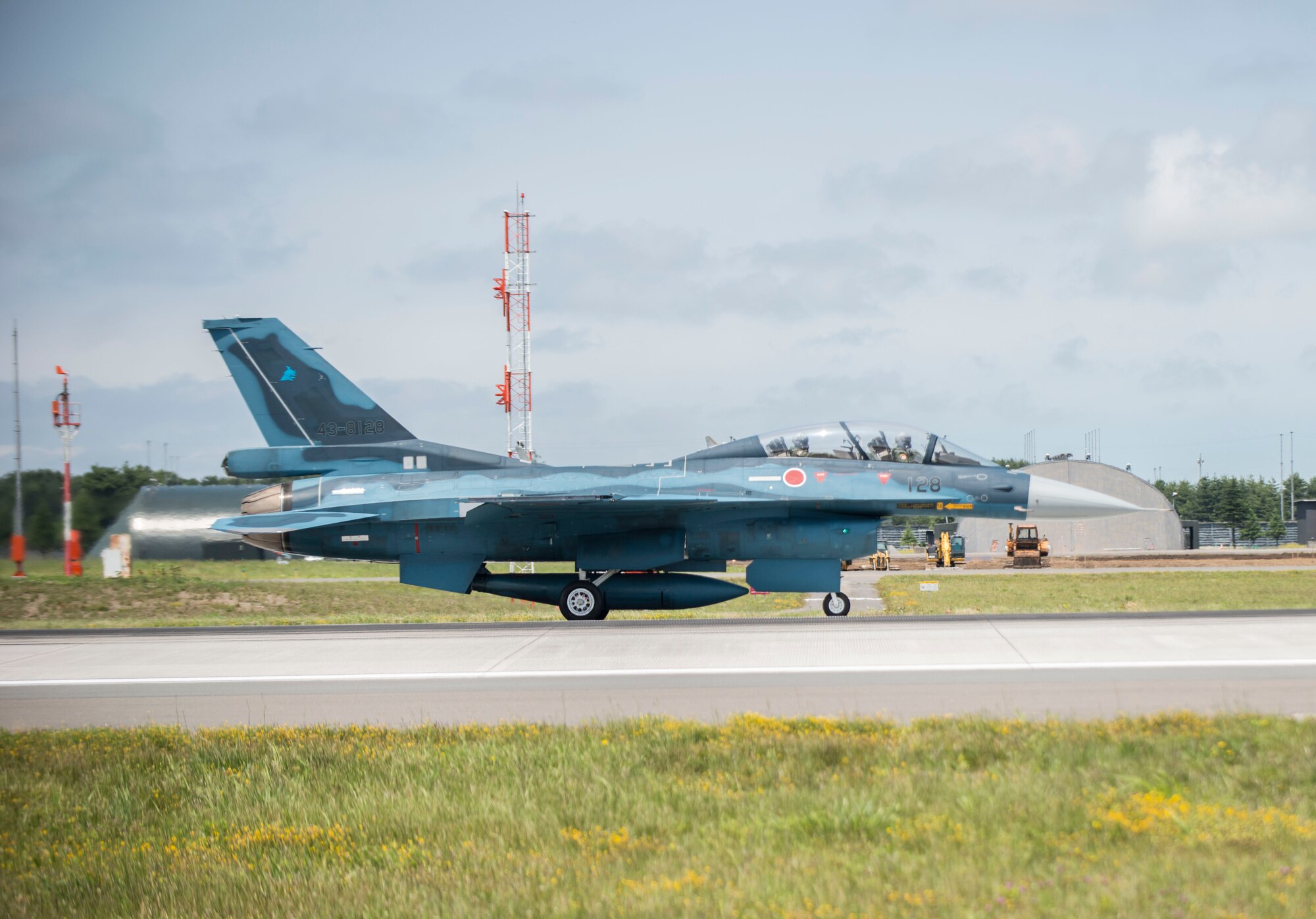 U.S. Air Force Col. Timothy Sundvall, the commander of the 35th Fighter Wing, and Lt. Col. Mikio Kobayashi, the commander of the 3rd Fighter Squadron, take off in an F-2A at Misawa Air Base, Japan, June 22, 2016. This was the first flight for Sundvall in an F-2A which is able to reach a max speed of Mach 2. (U.S. Air Force photo by Senior Airman Brittany A. Chase)