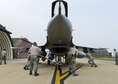 Airmen assigned to the 148th Aircraft Maintenance Unit push an F-16 Fighting Falcon into a hardened aircraft shelter, June 21, 2016, at Osan Air Base, Republic of Korea. The Airmen and F-16s from the Minnesota Air National Guard’s 148th Fighter Wing deployed to Osan as part of a Theater Security Package for U.S. Pacific Command and Pacific Air Forces. (U.S. Air Force photo by Senior Airman Victor J. Caputo/Released)