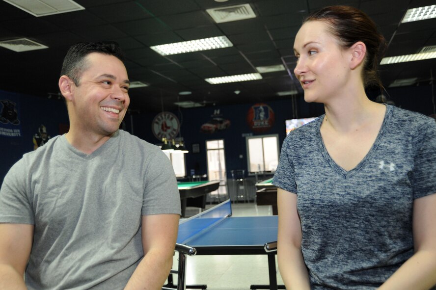 Tech Sgt. Holly Flores and Senior Airman Joseph Flores deployed together in support of Operation INHERENT RESOLVE from the 129th Rescue Wing at Moffett Field in Mountain View, California. The military couple spent five days apart before reuniting once Holly arrived, avoiding a potential six month separation. (U.S. Air Force photo by Senior Airman Zachary Kee)