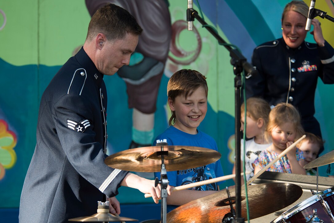 U.S. Air Force Senior Airman Eric Wheeler finishes his drum solo with the help of a fan during a performance June 19, 2016, in Mogilev, Belarus. Wheeler is a drummer with the U.S. Air Forces in Europe Band’s Ambassadors Jazz Ensemble. The USAFE band is in Belarus to perform and commemorate the alliance that ended the greatest conflict of the 20th Century. (U.S. Air Force photo/Technical Sgt. Paul Villanueva II)