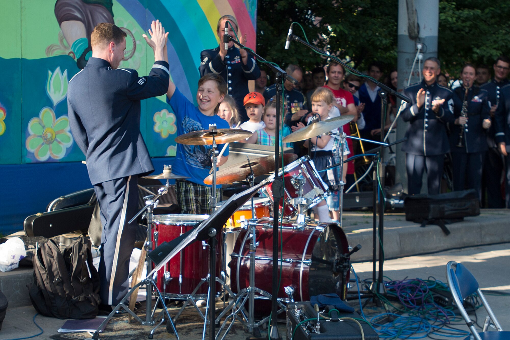 U.S. Air Force Senior Airman Eric Wheeler congratulates a fan for performing with him during a performance June 19, 2016, in Mogilev, Belarus. Wheeler is a drummer with the U.S. Air Forces in Europe Band’s Ambassadors Jazz Ensemble. The USAFE band performed in Belarus and surrounding communities to commemorate the alliance that ended the greatest conflict of the 20th Century. (U.S. Air Force photo/Technical Sgt. Paul Villanueva II)