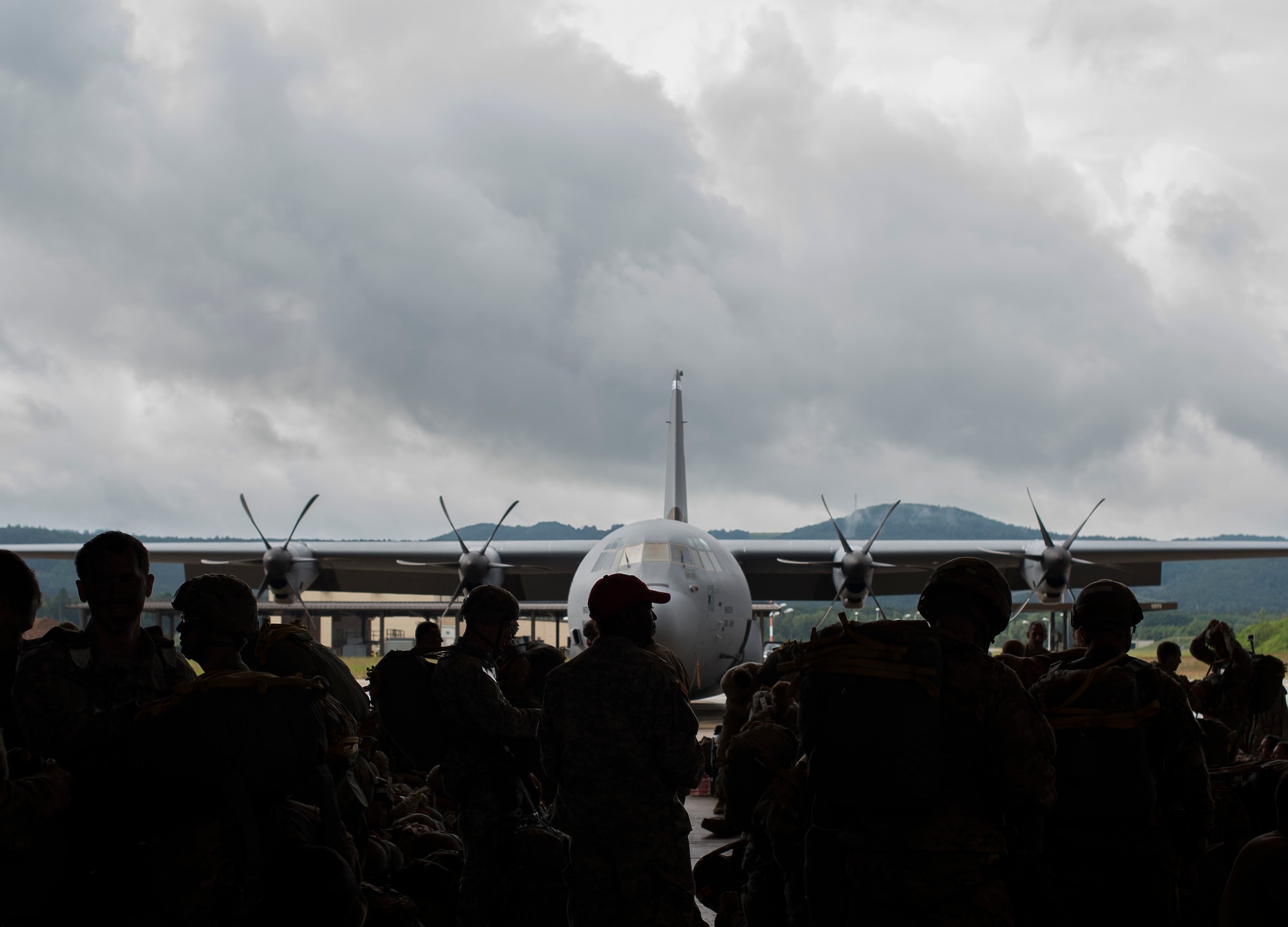 Soldiers perform final checks on their parachutes prior to entering a C-130J Super Hercules as part of this year’s annual Swift Response training exercise June 15, 2016, at Ramstein Air Base, Germany. Swift Response is a joint and multination exercise designed to train U.S. and NATO forces for global response. (U.S. Air Force photo/Senior Airman Damon Kasberg)