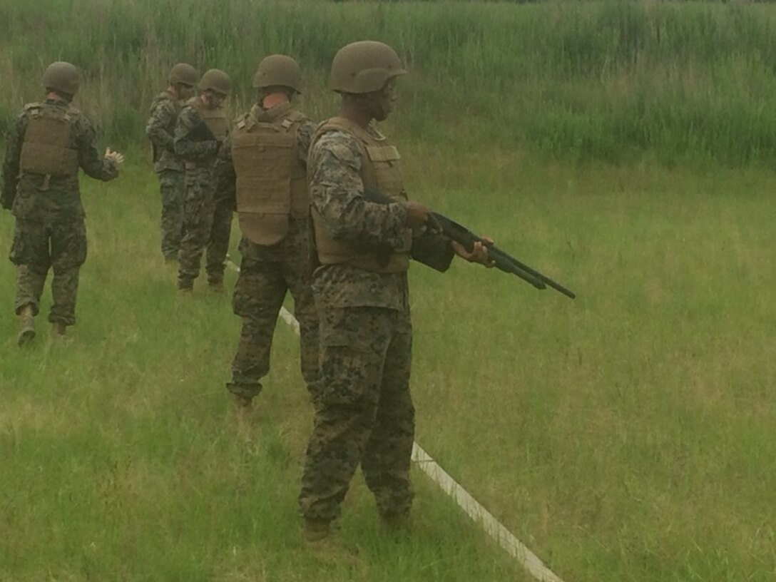 On June 6, 2016 Gunnery Sergeant John Cheze, an instructor with Combat Engineer Instruction Company; instructs Marine officers attached to Combat Engineer Officer course 5-16 (CEO 5-16) on proper shotgun firing techniques at Marine Corps Engineer School aboard Camp Lejeune, N.C. CEO students receive training covering shotgun handling, firing, and breaching. Pictured from left to right are Gunnery Sergeant John Cheze, and Second Lieutenants Justin Wilkison, Nicholas Downey, Thomas Cofer, and Aaron Graham.  

