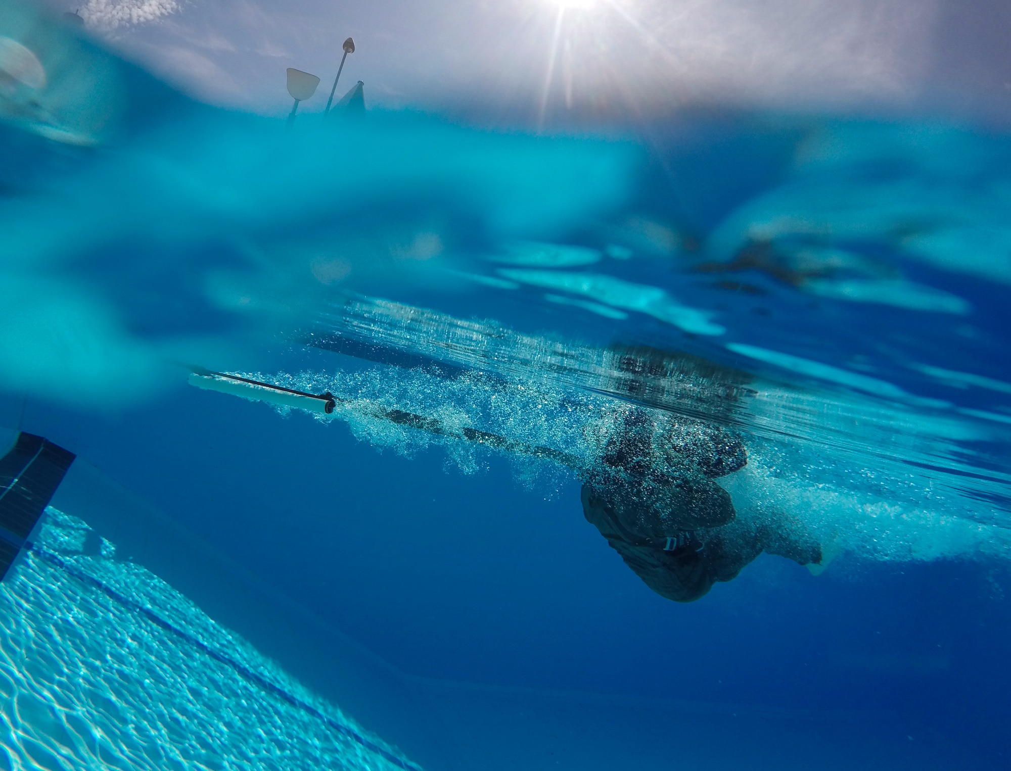 An F-16 Fighting Falcon pilot from the 555th Fighter Squadron is drug through the water by a parachute harness at Aviano Air Base, Italy, June 13, 2016. 31st Operations Support Squadron survival, evasion, resistance and escape specialists provides refresher training to pilots. (U.S. Air Force photo by Senior Airman Krystal Ardrey/Released)