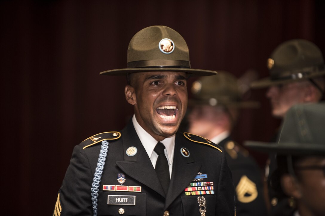 Staff Sgt. Rick Hurt, a new graduate of the Drill Sergeant Course at the U.S. Army Drill Sergeant Academy, calls cadence for the Soldiers of class 008-016 as they exit the Post Theater at Fort Jackson, S.C. after a graduation ceremony, June 22. (U.S. Army photo by Sgt. 1st Class Brian Hamilton/ released)