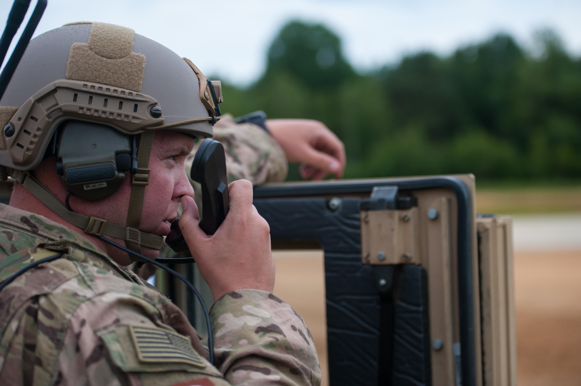 Maj. Aaron Cook, a 621st Mobility Support Operations Squadron air mobility liaison officer to the 2nd Cavalry Regiment/Joint Multinational Training Center, advises a C-130J Super Hercules pilot during exercise Swift Response 16 at Hohenfels Training Area, Germany, June 17, 2016. Swift Response is one of the premier military crisis response training events for multinational airborne forces in the world. This year, the exercise had more than 5,000 participants from 10 NATO nations. (U.S. Air Force photo/Master Sgt. Joseph Swafford)