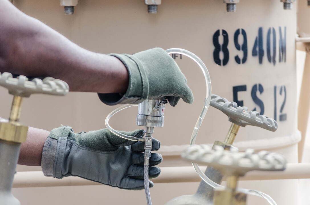 FORT BRAGG, N.C. - A Soldier from the 894th Quartermaster Company from Jackson, Mississippi, recirculates fuel to ensure foreign particles are absent from the samples they will draw to be examined by the lab. Pure samples are essential to testing of materials for proper identification and accuracy of lab results. (U.S. Army photo by Sgt. William Battle, 372nd Mobile Public Affairs Detachment)