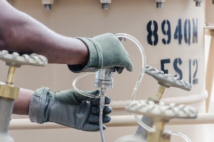 FORT BRAGG, N.C. - A Soldier from the 894th Quartermaster Company from Jackson, Mississippi, recirculates fuel to ensure foreign particles are absent from the samples they will draw to be examined by the lab. Pure samples are essential to testing of materials for proper identification and accuracy of lab results. (U.S. Army photo by Sgt. William Battle, 372nd Mobile Public Affairs Detachment)