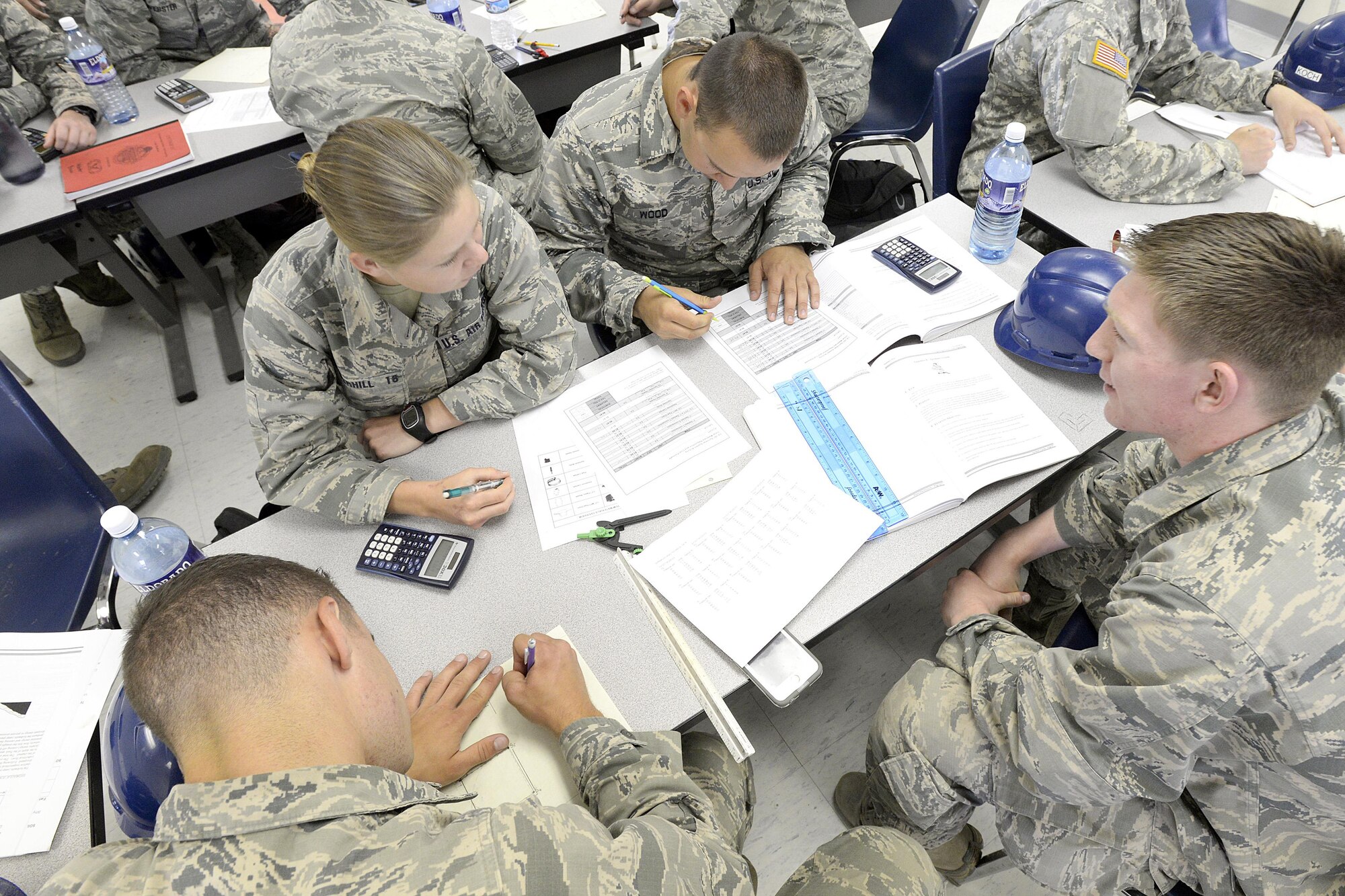 Cadets at the U.S. Air Force Academy study design plans June 22, 2016 for two homes they will build for the Navajo Nation. The cadets are participating in the Academy's Field Engineering and Readiness Laboratory, a five-week summer course for civil and environmental engineering majors at the school. (U.S. Air Force photo/Mike Kaplan)