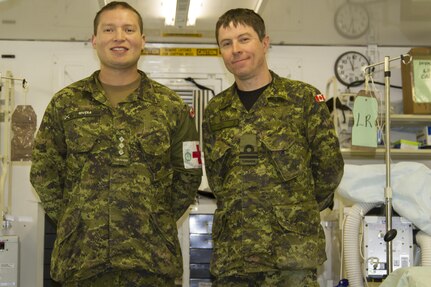 Canadian Army Capt. Harold Rivera, combat nurse, and Canadian Navy Lt. Eric Baker, pharmacist, Garrison Petawawa, Ottawa, Canada, are two allied forces joining U.S. Army Reserve Soldiers at the 325th Combat Support Hospital during Combat Support Training Exercise 91-16-02, Fort Hunter Liggett, Calif., June 18, 2016. As the largest U.S. Army Reserve training exercise, CSTX 91-16-02 provides Soldiers with unique opportunities to sharpen their technical and tactical skills in combat-like conditions. (U.S. Army photo by Spc. Fatima Konteh, 367th Mobile Public Affairs Detachment)