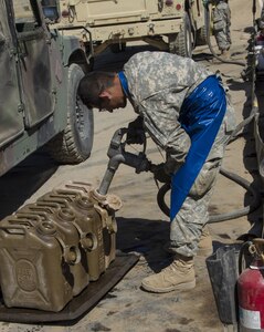 U.S. Army Reserve Pvt. Manuel Morgan, 1017th Quartermaster Company, Camp Pendleton, Calif., fills fuel cans at Tactical Assembly Area Schoonover during Combat Support Training Exercise 91-16-02 on June 20, 2016, Fort Hunter Liggett, Calif. As the largest U.S. Army Reserve training exercise, CSTX 91-16-02 provides Soldiers with unique opportunities to sharpen their technical and tactical skills in combat-like conditions. (U.S. Army photo by Sgt. Krista L. Rayford, 367th Mobile Public Affairs Detachment)