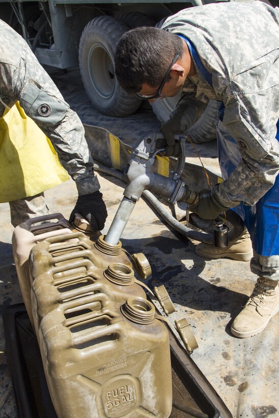 U.S. Army Reserve Pvt. Manuel Morgan, 1017th Quartermaster Company, Camp Pendleton, Calif., fills fuel cans at Tactical Assembly Area Schoonover during Combat Support Training Exercise 91-16-02 on June 20, 2016, Fort Hunter Liggett, Calif. As the largest U.S. Army Reserve training exercise, CSTX 91-16-02 provides Soldiers with unique opportunities to sharpen their technical and tactical skills in combat-like conditions. (U.S. Army photo by Sgt. Krista L. Rayford, 367th Mobile Public Affairs Detachment)