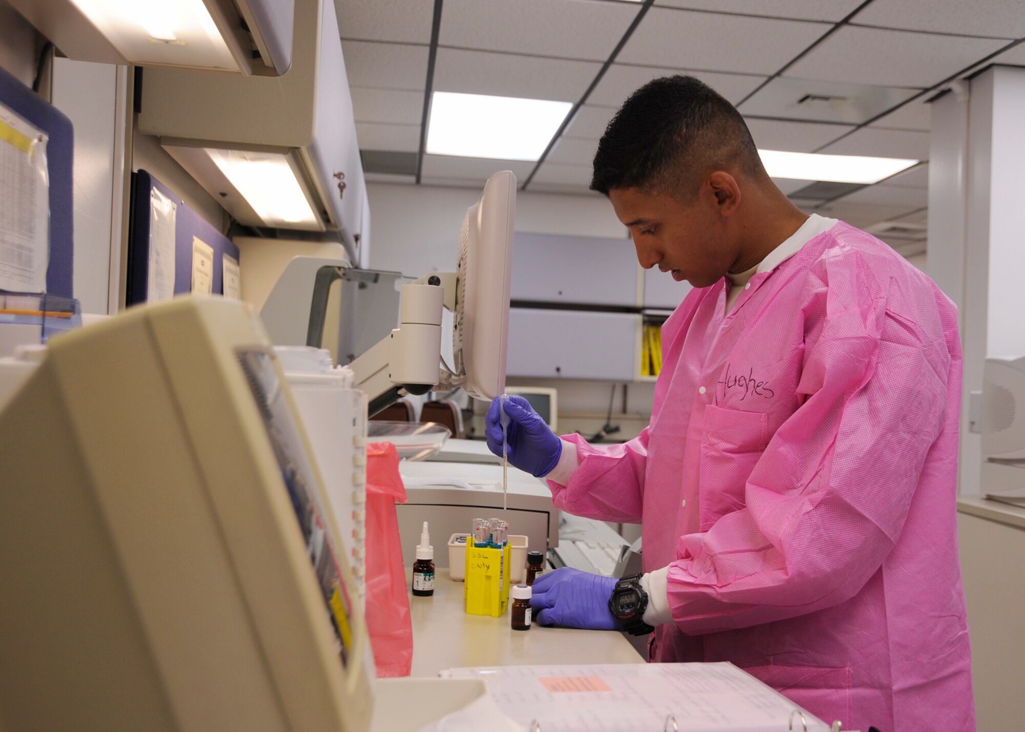 U.S. Air Force Airman 1st Class Jadlow Hughes, 325th Medical Support Squadron laboratory technician, performs tests on glucose levels of a patient in the 325th MDSS laboratory, June 20, 2016. These are known as hemoglobin A1C tests, which reflects the average blood glucose control and is an important measurement for those with diabetes. (U.S. Air Force photo by Senior Airman Solomon Cook/Released)