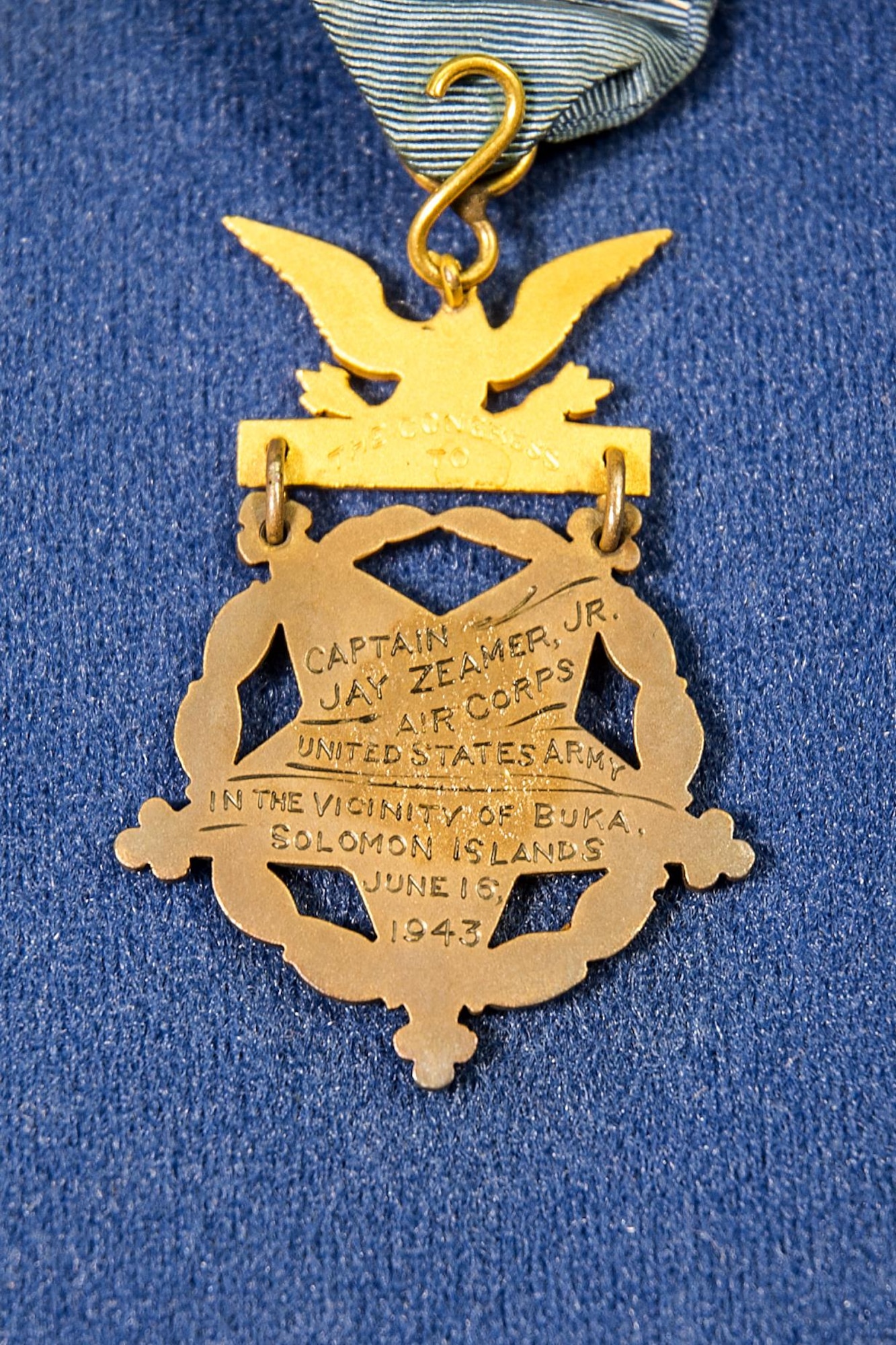 DAYTON, Ohio -- Rear side of Capt. Jay Zeamer's Medal of Honor on display in the WWII Gallery at the National Museum of the U.S. Air Force. The Medal of Honor is the highest award for valor in action against an enemy force which can be bestowed upon an individual serving in the Armed Services of the United States.  Zeamer's remarkable B-17 crew was the most highly-decorated aircrew in history. Zeamer and the bombardier, 2nd Lt. Joseph Sarnoski, received the Medal of Honor, while seven other members of the crew were awarded the Distinguished Service Cross, the Nation's second highest honor. Nearly all received the Purple Heart for wounds sustained in combat. (U.S. Air Force photo by Ken LaRock)