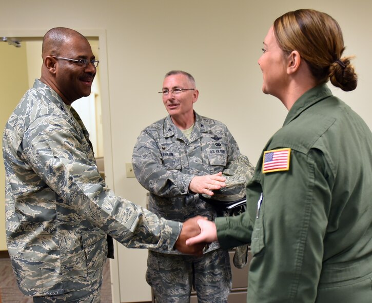 The new vice commander at the 932nd Airlift Wing, Colonel Esteban “Esty” Ramirez, is introduced by Col. Jonathan Philebaum, 932nd Airlift Wing commander (center), to Senior Airman Samantha Strom, an emergency medical technician in the 932nd Aeromedical Evacuation Squadron.  The flying unit takes care of patients in the air on a variety of aircraft, and must be worldwide ready throughout the year.  The 932nd Airlift Wing belongs to 22nd Air Force, under Air Force Reserve Command.   (U.S. Air Force photo by Tech. Sgt. Christopher Parr)