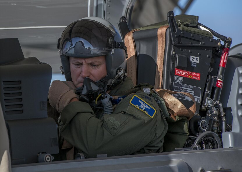 U.S. Air Force Col. Joseph Locke, 93d Air Ground Operations Wing commander, secures his mask before taking off in an A-29 Super Tucano, June 23, 2016, at Moody Air Force Base, Ga. Locke flew the A-29 as preparation for his upcoming deployment to Southwest Asia. (U.S. Air Force photo by Tech. Sgt. Zachary Wolf/Released)