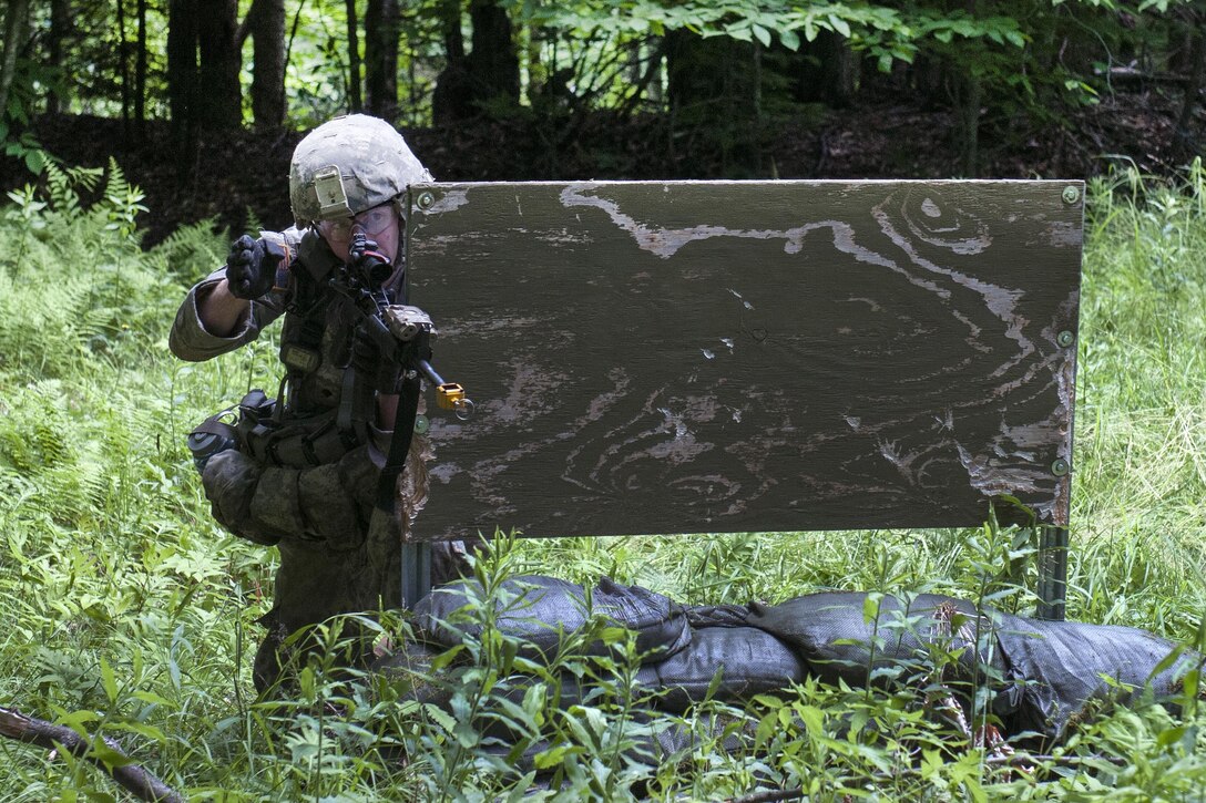 Army Spc. Daniel Broderick signals for his team to move forward during an assault lane exercise at Camp Ethan Allen Training Site in Jericho, Vt., June 14, 2016. Broderick is assigned to the Vermont National Guard’s Company D, 3rd Battalion, 172nd Infantry Regiment, 86th Infantry Brigade Combat Team (Mountain). Army National Guard photo by Spc. Avery Cunningham
