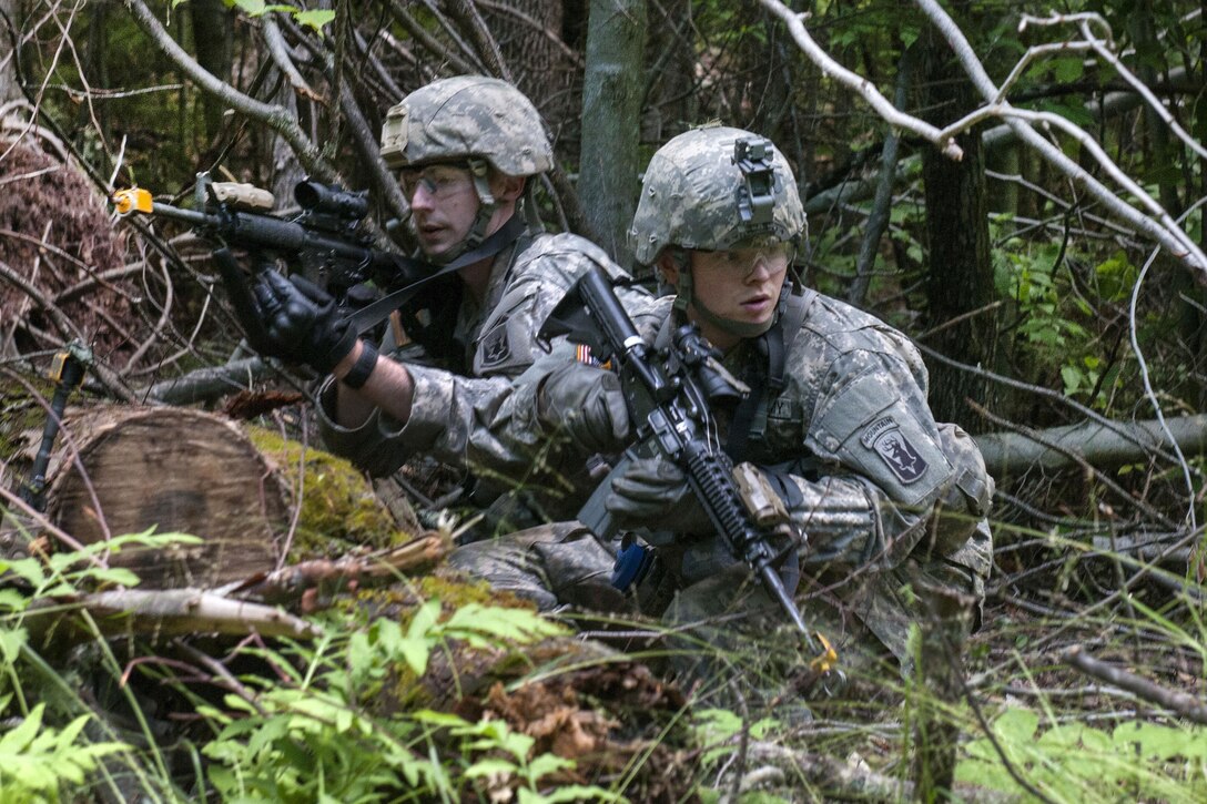 Army Spc. Daniel Broderick, left, and ROTC Cadet Colin Lozito take cover during an assault lane exercise at Camp Ethan Allen Training Site in Jericho, Vt., June 14, 2016. Broderick and Lozito are assigned to the Vermont National Guard’s Company D, 3rd Battalion, 172nd Infantry Regiment, 86th Infantry Brigade Combat Team (Mountain). Army National Guard photo by Spc. Avery Cunningham