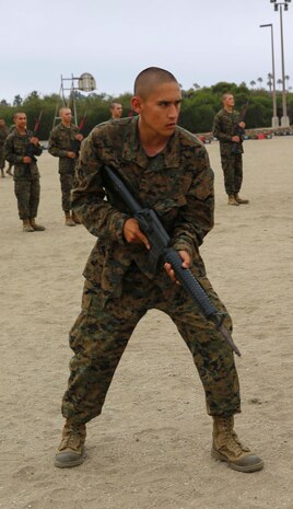 A recruit from India Company, 3rd Recruit Training Battalion, practices his technique during a modified bayonet assault course at Marine Corps Recruit Depot San Diego, June 21. Recruits were taught different moves during Marine Corps Martial Arts Program classes, learning offensive and defensive techniques used in combat. Annually, more than 17,000 males recruited from the Western Recruiting Region are trained at MCRD San Diego. India Company is scheduled to graduate July 15.