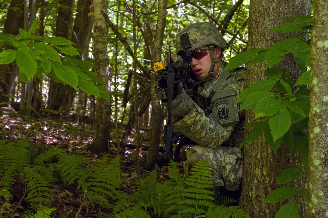 Army Pfc. Liam Ingram engages the opposing force during an assault lane exercise at Camp Ethan Allen Training Site in Jericho, Vt., June 15, 2016. Liam is assigned to the Vermont National Guard’s Company A, 3rd Battalion, 172nd Infantry Regiment, 86th Infantry Brigade Combat Team (Mountain). Army National Guard photo by Spc. Avery Cunningham