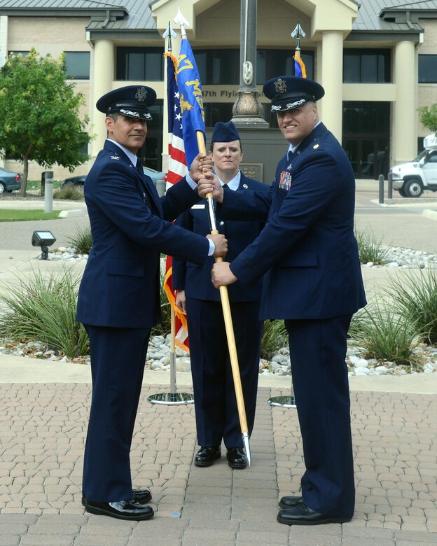 Maj. Darren James, right, 47th Force Support Squadron commander, poses for a photo with Col. Eric Shafa, 47th Mission Support Group commander, during a change of command at Laughlin Air Force Base, Texas, June 17, 2016. James came to Laughlin from his previous position as a student at the Air Command and Staff College. (U.S. Air Force photo/Senior Airman Jimmie D. Pike)