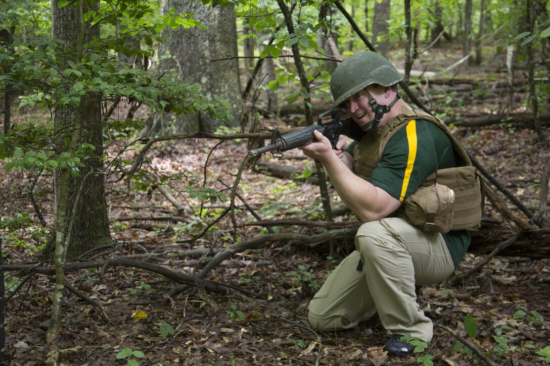 Steve Winfrey provides security during the patrolling portion of the 2016 Key Leaders and Educators Workshop aboard Marine Corps Base Quantico, Va., June 23. Approximately 40 educators from states west of the Mississippi River participated in activities such as Marine Corps Martial Arts training, flying in an MV-22 Osprey and many others during the week-long workshop. Winfrey is an administrator for North Dakota State University, Fargo, ND.