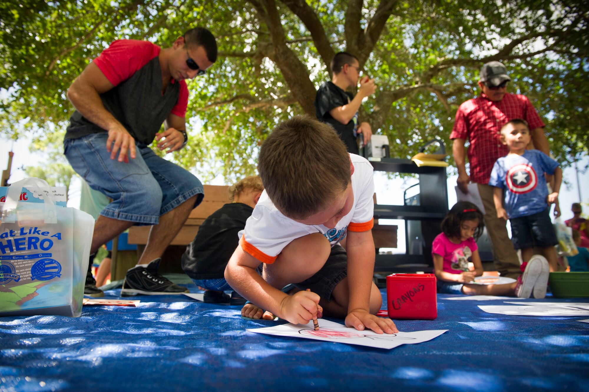 A child colors a drawing during a Summer Reading Program event at Hurlburt Field, Fla., June 23, 2016. During the event, children participated in physical activities while learning the importance of fruit and vegetable intake. (U.S. Air Force photo by Senior Airman Krystal M. Garrett)