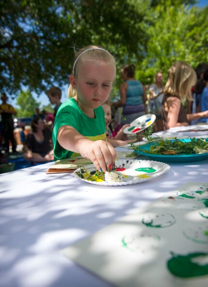 Children participate in vegetable stamp painting during a Summer Reading Program event at Hurlburt Field, Fla., June 23, 2016. During the event, children participated in physical activities while learning the importance of fruit and vegetable intake. (U.S. Air Force photo by Senior Airman Krystal M. Garrett)