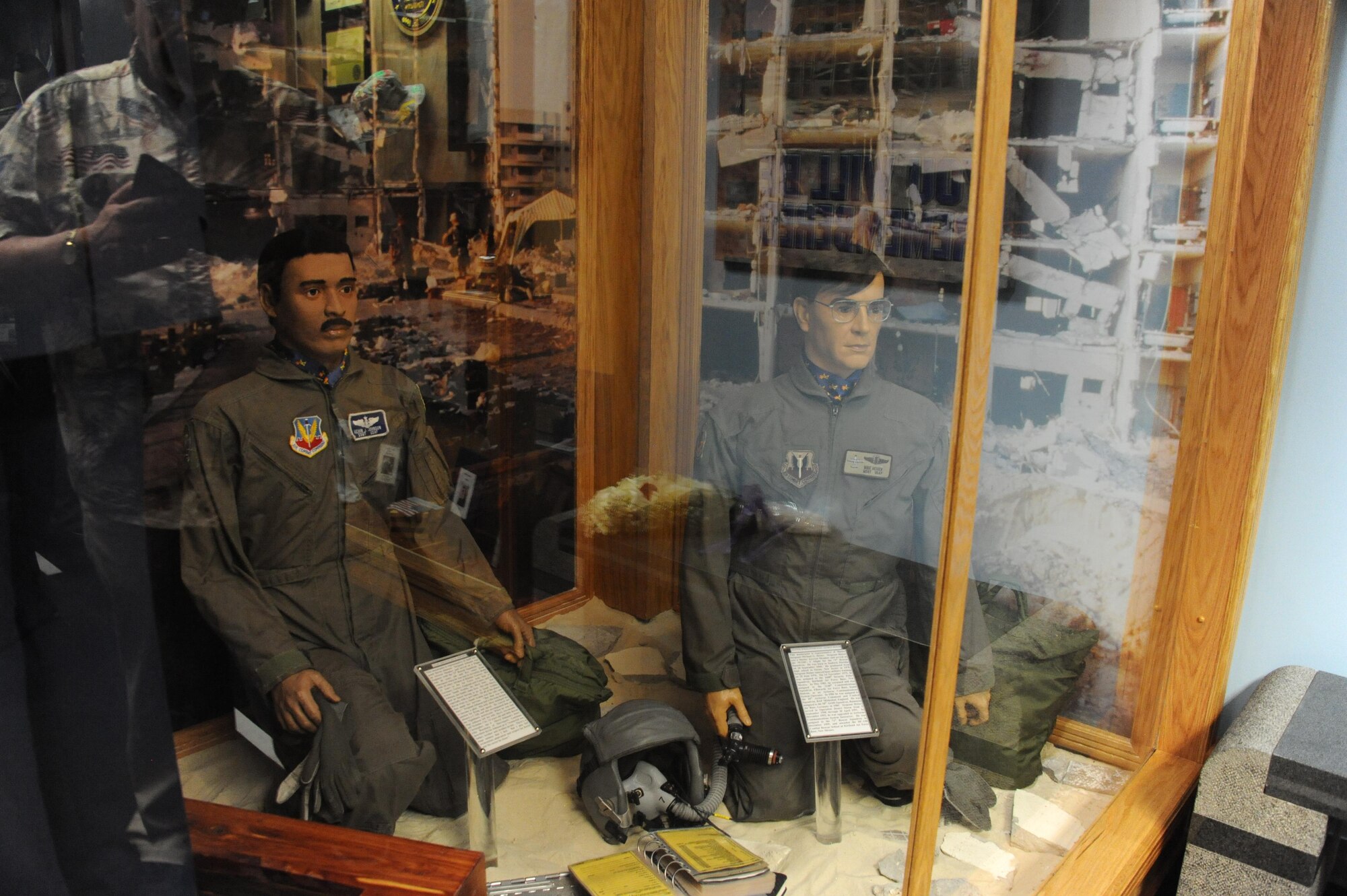 The Khobar Towers attack memorial sits on display during the 20th anniversary of the terrorist bombing and exhibit unveiling, June 23, 2016, Maxwell Air Force Base, Ala. The exhibit features the uniforms of three of 19 Airmen who perished that day, along with a plaque with all of their names and artifacts from the rubble of the living complex. (U.S. Air Force photo/Senior Airman Alexa Culbert) 