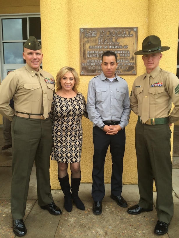 From left to right: Maj. James Ramsey, Minerva “Minnie” Ramsey, Sgt. Daniel “D.J.” Deleon and Sgt. Shaun Kellam pose for a picture after Kellam’s graduation from Drill Instructor School at Marine Corps Recruit Depot San Diego, Calif., December 2014. Kellam joined the Marine Corps in 2008, following in the footsteps of Maj. Ramsey. (Courtesy photo/Released)