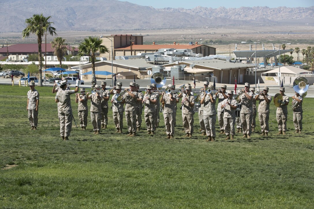 The 3rd Marine Aircraft Wing Band performs the Marines’ Hymn at the end of Marine Wing Support, Squadron 374’s change of command at Lance Cpl. Torrey L. Gray Field, June 17, 2016. (Official Marine Corps photo by Cpl. Thomas Mudd/Released)