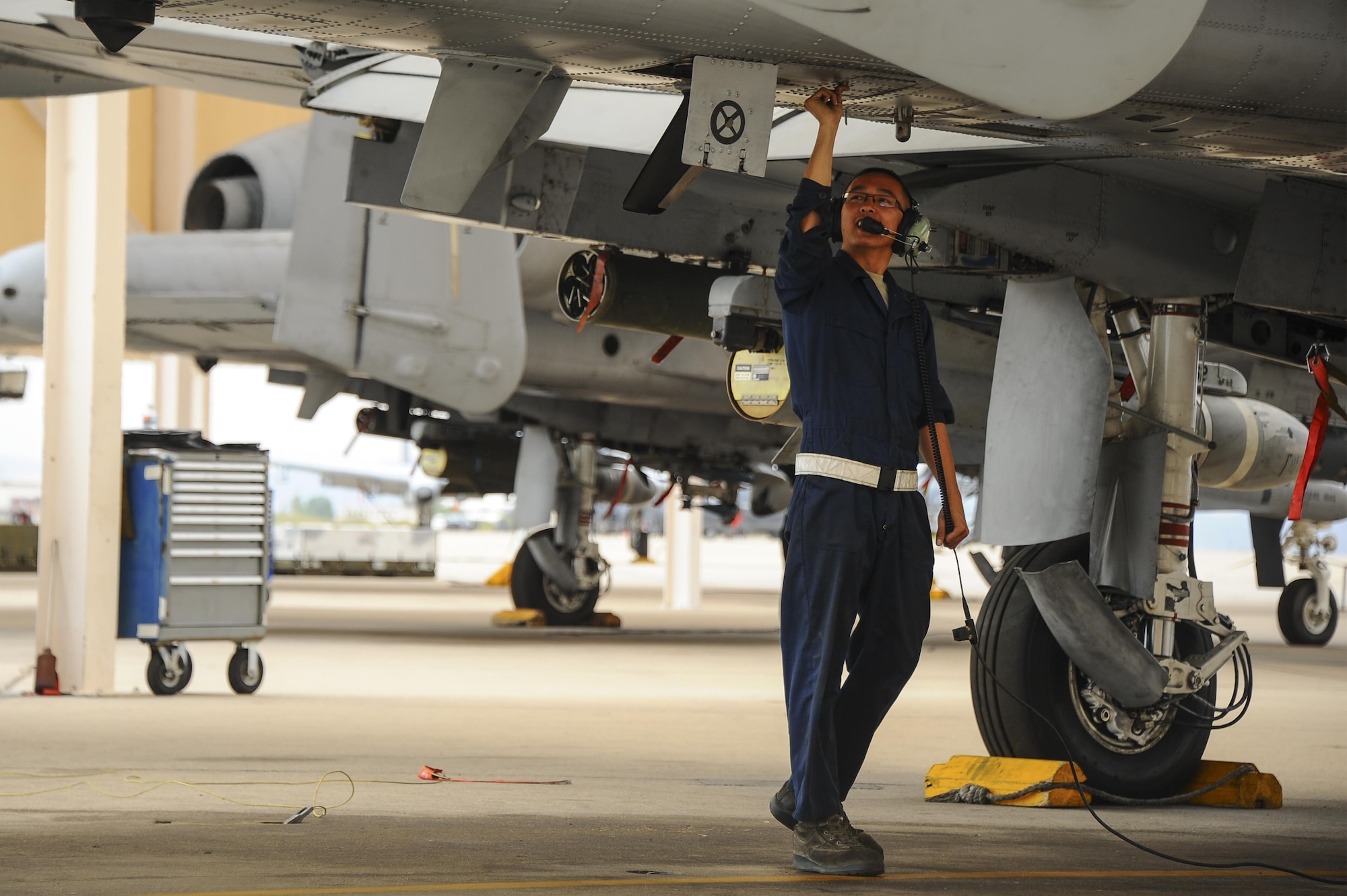 U.S. Air Force Senior Airman Andy Bui, 355th Aircraft Maintenance Squadron A-10C Thunderbolt II crew chief, closes a snap panel of an A-10 on the flightline at Davis-Monthan Air Force Base, Ariz., June 23, 2016. The 355th AMXS provides safe and properly configured aircraft in order to meet mission requirements for three squadrons. (U.S. Air Force photo by Airman 1st Class Mya M. Crosby/Released)