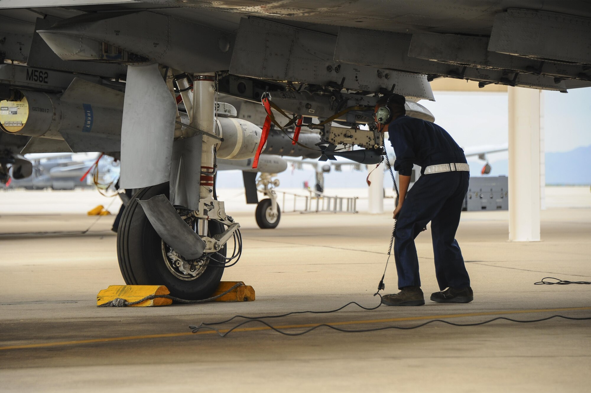 U.S. Air Force Senior Airman Andy Bui, 355th Aircraft Maintenance Squadron A-10C Thunderbolt II crew chief, performs an operational check on the flightline at Davis-Monthan Air Force Base, Ariz., June 23, 2016. The 355th AMXS develops and executes scheduled maintenance and provides forces to support worldwide contingency tasking. (U.S. Air Force photo by Airman 1st Class Mya M. Crosby/Released)