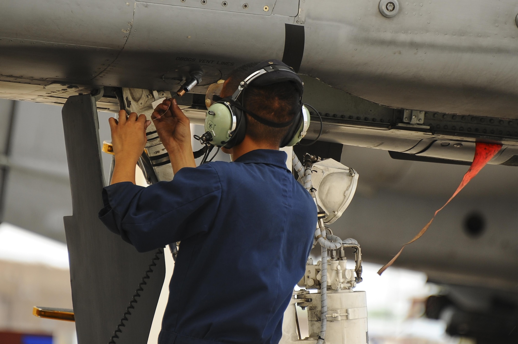 U.S. Air Force Senior Airman Andy Bui, 355th Aircraft Maintenance Squadron A-10C Thunderbolt II crew chief, performs an operational check on the flightline at Davis-Monthan Air Force Base, Ariz., June 23, 2016. The checklists are designed to ensure the safety of the aircraft and the pilot before takeoff. (U.S. Air Force photo by Airman 1st Class Mya M. Crosby/Released)