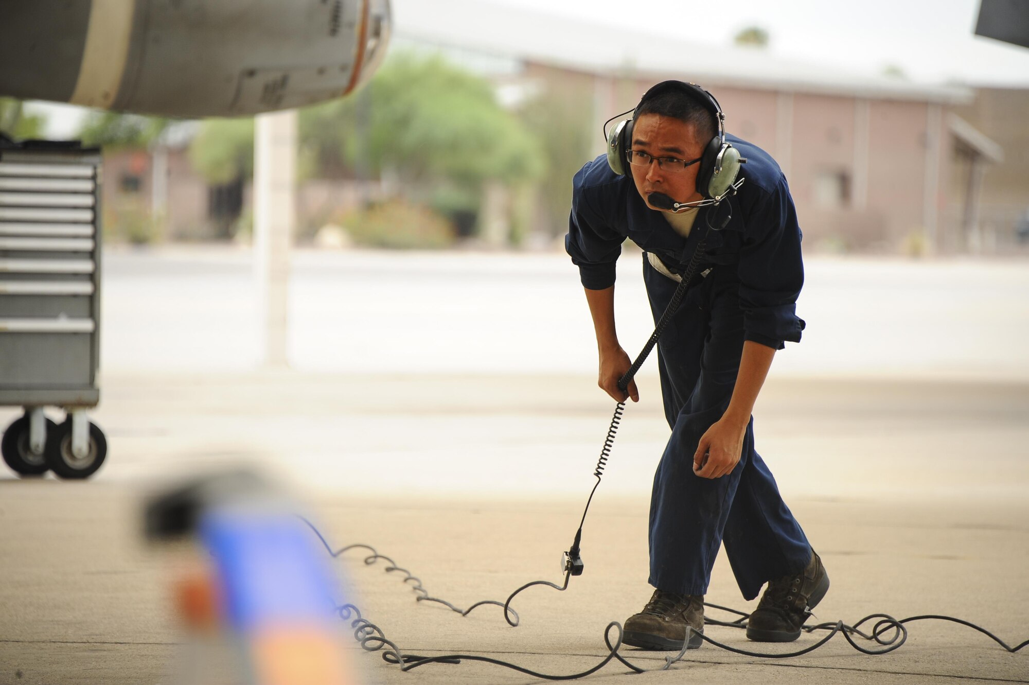 U.S. Air Force Senior Airman Andy Bui, 355th Aircraft Maintenance Squadron A-10C Thunderbolt II crew chief, inspects an A-10 on the flightline before takeoff at Davis-Monthan Air Force Base, Ariz., June 23, 2016. The 355th AMXS generates all combat and training sorties in the 355th Fighter Wing and manages the efforts of 500 Airmen in 10 specialties maintaining A-10C attack aircraft. (U.S. Air Force photo by Airman 1st Class Mya M. Crosby/Released)