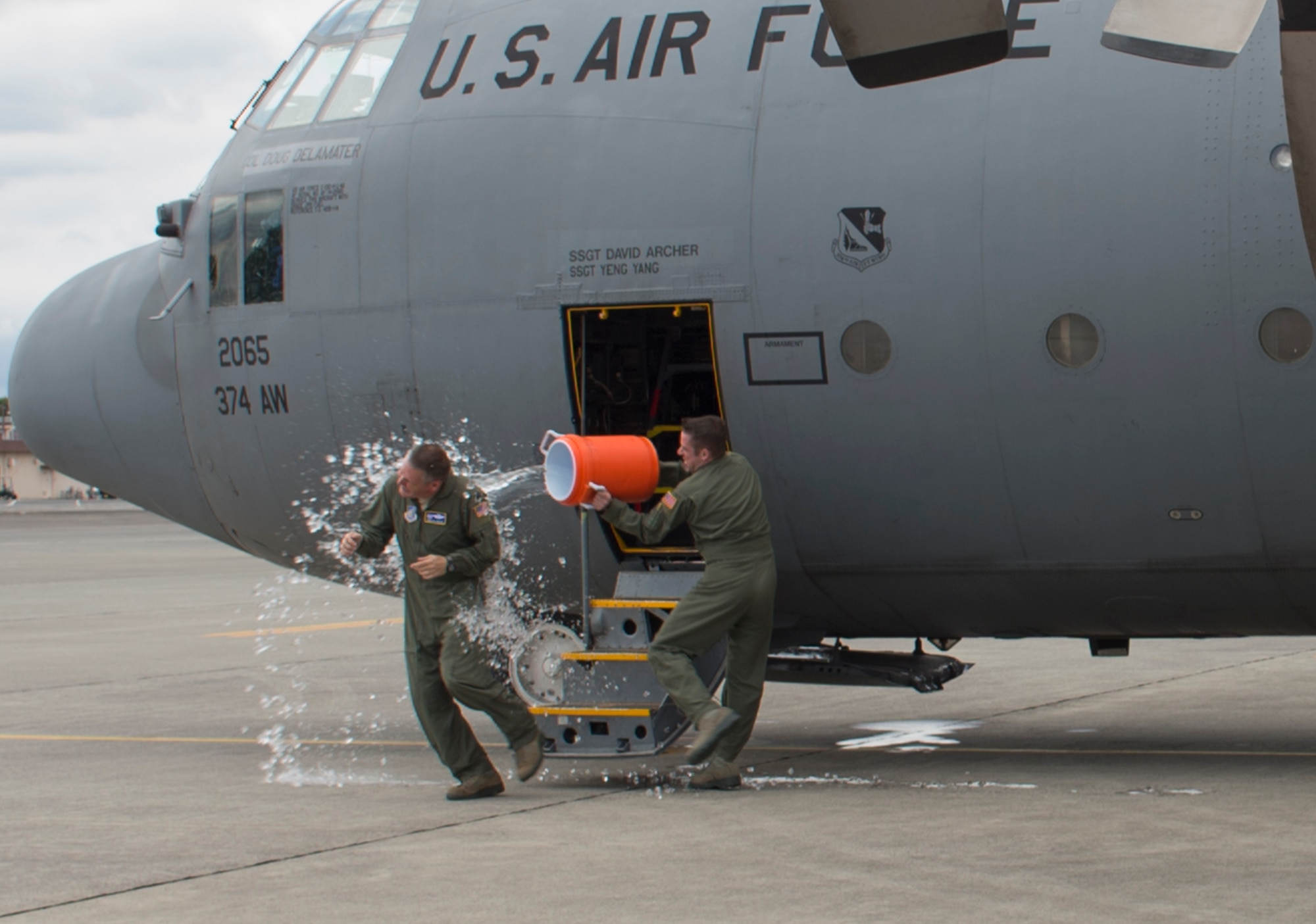 Col. Douglas DeLaMater, 374th Airlift Wing commander, plays with his daughter, Danica, after his final flight at Yokota Air Base, Japan, June 14, 2016. After 24 years of service, including 2,500 flight hours, DeLaMater is preparing to retire and spend more time with his family. (U.S. Air Force photo by Airman 1st Class Elizabeth Baker/Released)
