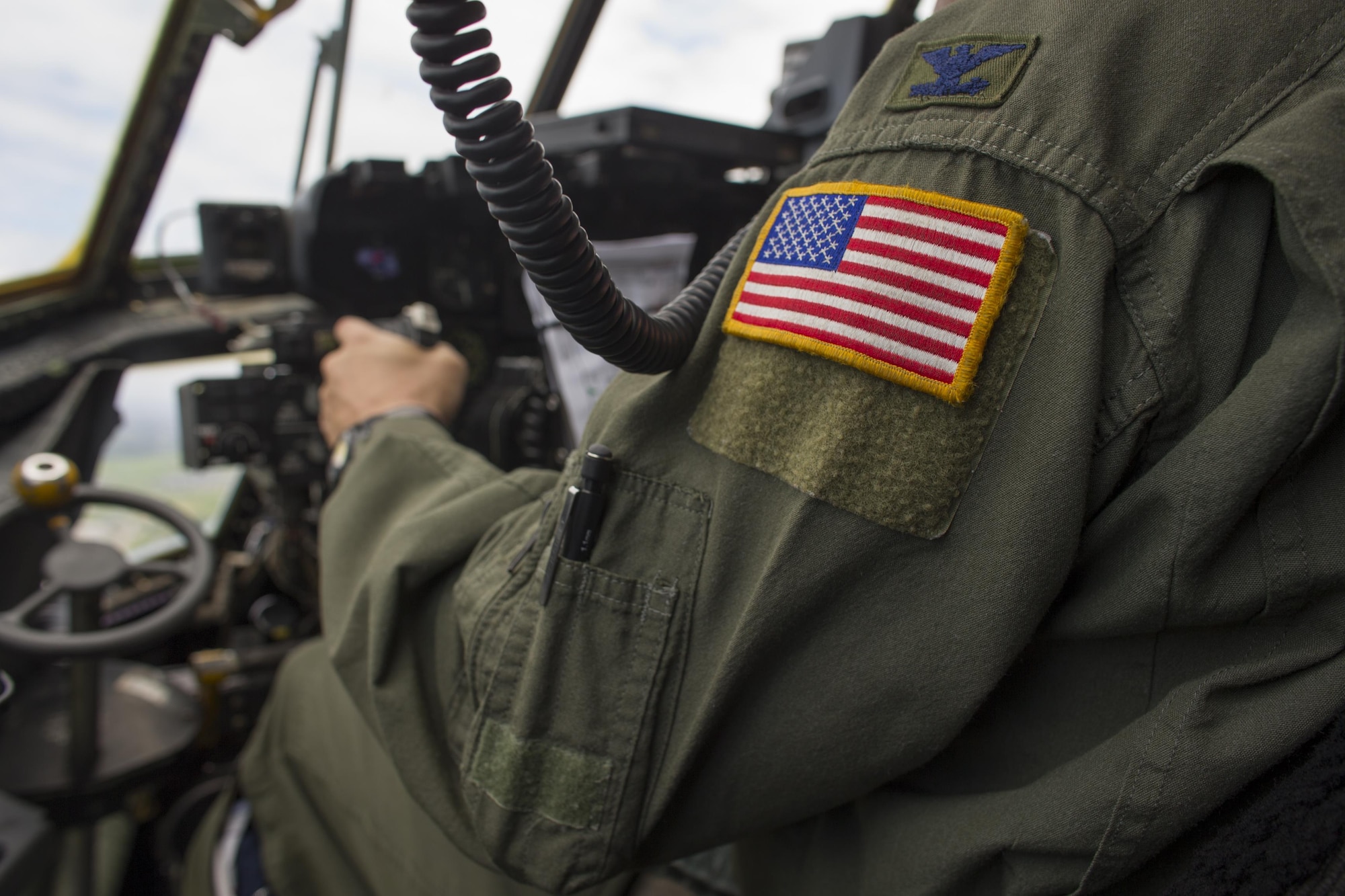 Col. Douglas DeLaMater, 374th Airlift Wing commander, pilots his final military aircraft flight on a C-130 Hercules over Yokota Air Base, Japan, June 14, 2016. ‘Fini’ flights are an Air Force tradition, with originating  in World War II, where a retiring aviator chooses his aircrew and flight plan for a final flight. Family, friends and colleagues gather to greet the aviator after the flight. (U.S. Air Force photo by Airman 1st Class Elizabeth Baker/Released)