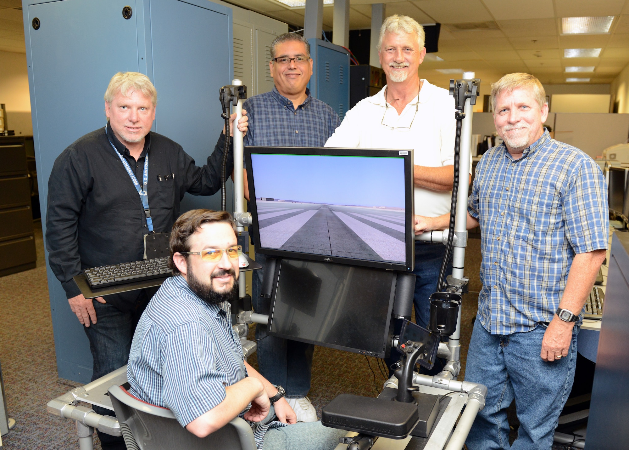 The new Portable Manned Interactive Cockpit is being built upon the success of the first interactive cockpit, which is pictured here, built by employees of the 772nd Test Squadron at the Integrated Facility for Avionics Systems Test. The new PMIC is designed to be more mobile and agile to transport to other simulator rooms and off base for events. The 412th Test Wing provided funding for the PMIC as part of its innovation initiative to encourage personnel around base to come up with innovative ideas and projects to improve the wing. (U.S. Air Force photo by Kenji Thuloweit)