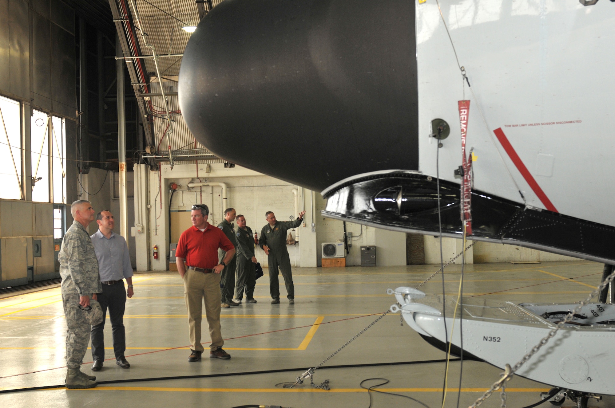 Col. Shawn Clouthier (left), 109th Airlift Wing commander, gives Gabe Camarillo (center) and Chris Swadener an up-close look at an LC-130 Skibird during a tour of Stratton Air National Guard Base, New York, on June 22, 2016. Camarillo is the Assistant Secretary of the Air Force for Manpower and Reserve Affairs, and Swadener is the Associate Director of Operations for the Air National Guard. (U.S. Air National Guard photo by Staff Sgt. Benjamin German/Released)