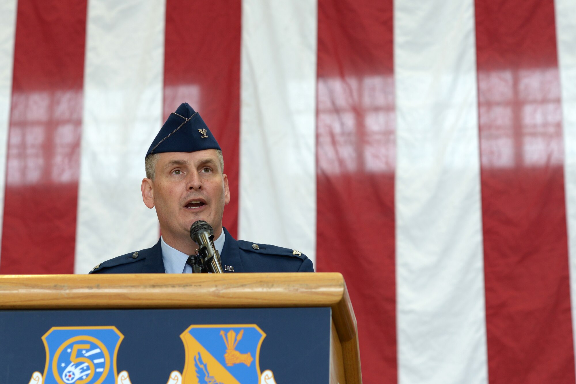 Col. Douglas DeLaMater, 374th Airlift Wing outgoing commander, reflects on his experience leading the men and women of the 374 AW and thanks them for their service during the official wing change of command at Yokota Air Base, Japan, June 24, 2016. DeLaMater relinquished his command to Col. Kenneth Moss. He will continue his service to the Air Force as a C-130J Super Hercules simulator instructor at Maxwell Air Force Base, Alabama. (U.S. Air Force photo by Staff Sgt. Cody H. Ramirez/Released)