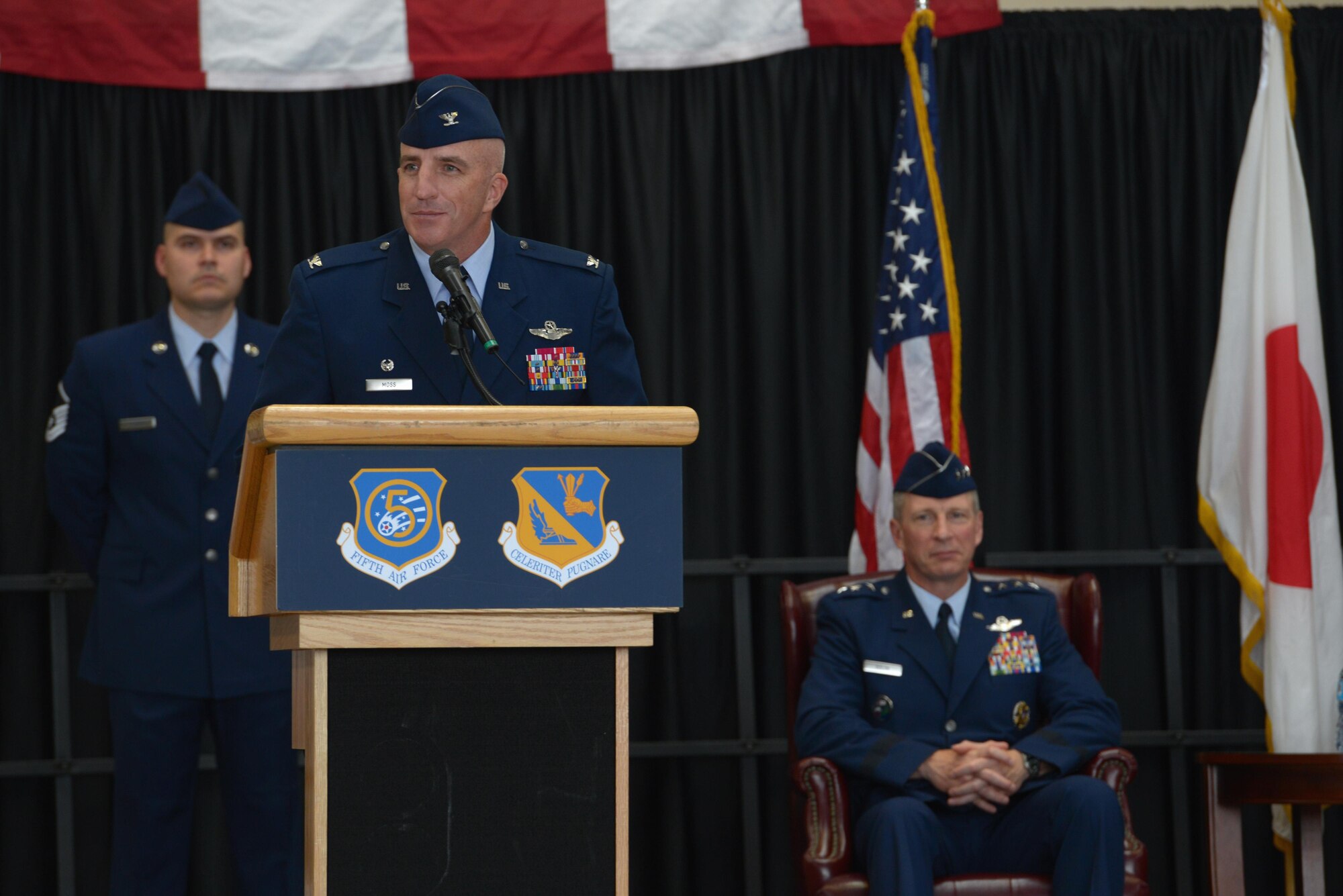 Col. Kenneth Moss, 374th Airlift Wing incoming commander, speaks to members of the audience during the official wing change of command at Yokota Air Base, Japan, June 24, 2016. Moss praised the 374 AW for their accolades and mentioned his excitement to continue to build on their excellent reputation and the strong U.S.-Japan partnership. (U.S. Air Force photo by Staff Sgt. Cody H. Ramirez/Released)