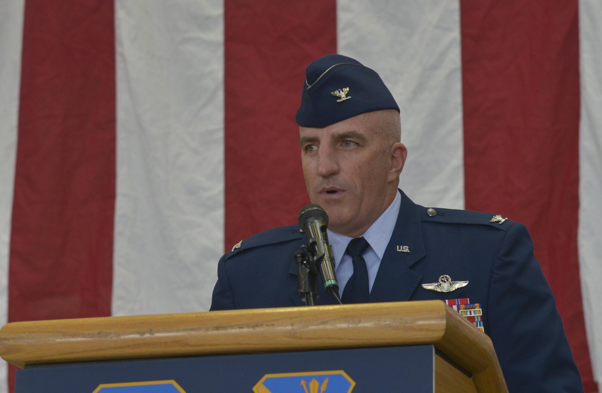 Col. Kenneth Moss, 374th Airlift Wing incoming commander, addresses personnel on his goals for the wing during the change of command ceremony at Yokota Air Base, Japan, June 24, 2016. Moss said he is looking forward to continuing to strengthen the alliance between the U.S. and Japan while leading Yokota members. (U.S. Air Force photo by Senior Airman David Owsianka/Released)