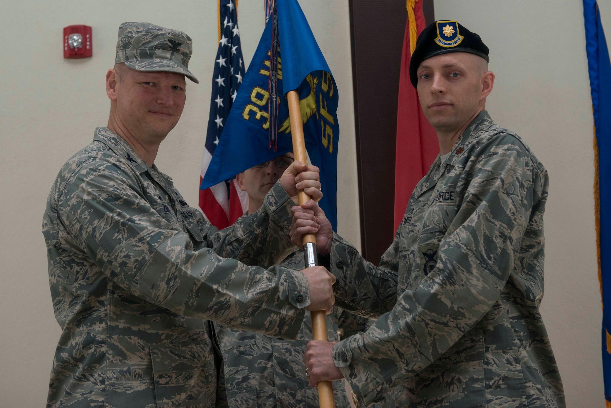 U.S. Air Force Maj. William Smith, 39th Security Forces Squadron incoming commander, receives command from U.S. Air Force Col. James, Zirkel, 39th Weapons System Security Group commander, June 24, 2016, at Incirlik Air Base, Turkey. Prior to taking command, Smith attended the Naval War College in Newport, R.I., where he completed an intermediate level program. (U.S. Air Force photo by Senior Airman John Nieves Camacho/Released)