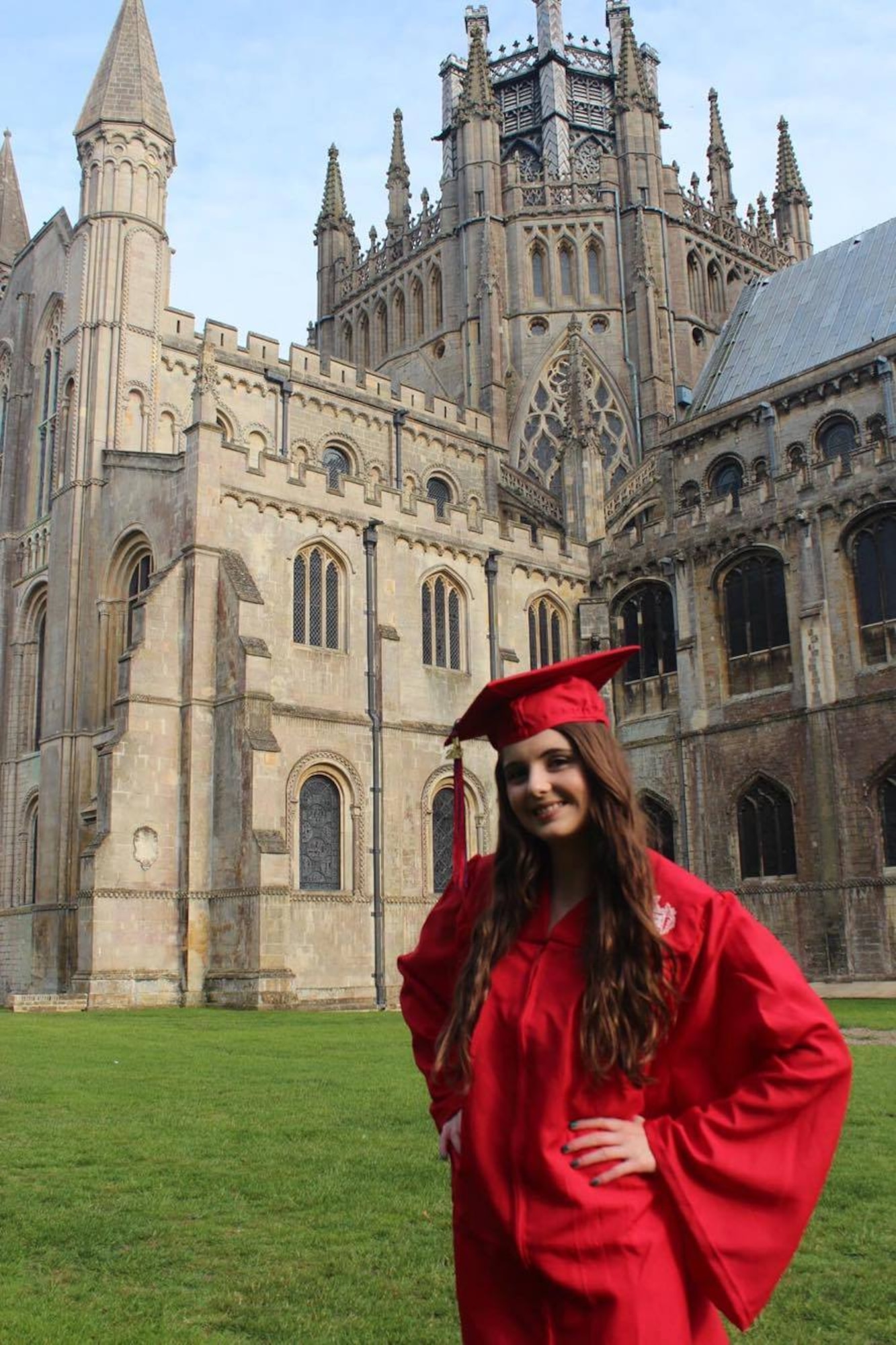 Lakenheath High School senior, Laci Clark, poses in front of Ely Cathedral following her graduation ceremony at Ely, England, June 10, 2016. Graduating students approached their final days at LHS with much anticipation and excitement for the future. (Courtesy photo) 