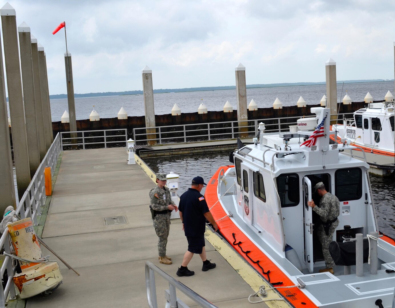 Members of the North Carolina National Guard’s 514th Military Police Company, based in Winterville, respond to simulated agitators trying to enter the port, during Operation Vigilant Seahawk at the Military Ocean Terminal Sunny Point (MOTSU). The exercise was designed to improve communication and coordination with state and federal partners during disaster response and recovery operations.