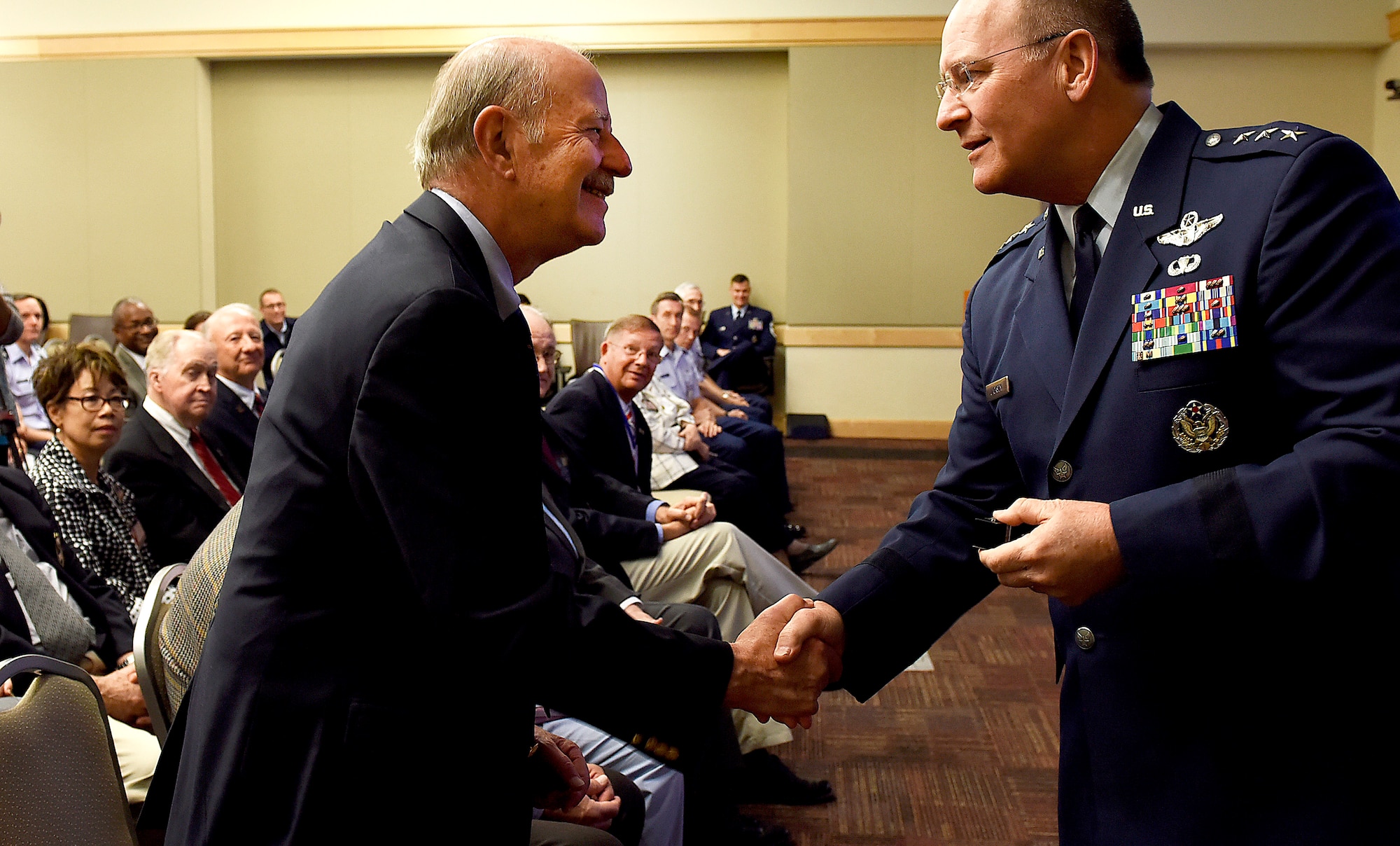 Lt. Gen. James Jackson (right), chief of Air Force Reserve, presents a Vietnam War veteran with a pin during a ceremony at the Pentagon, Washington, D.C., June 21, 2016. More than 10 veterans were recognized during the ceremony. (U.S. Air Force photo by Staff Sgt. Alyssa C. Gibson/Release)